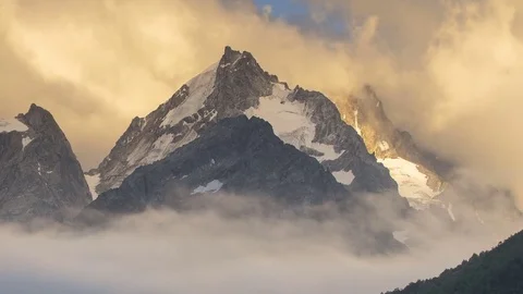 The formation and movement of clouds over the summer slopes of Bolshoy Thach Stock Footage 83673836