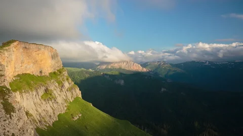 The formation and movement of clouds over the summer slopes of Mountains Stock Footage 149353094