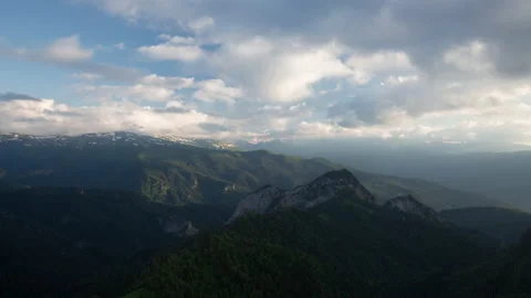 The formation and movement of clouds over the summer slopes of Mountains Stock Footage 149353167