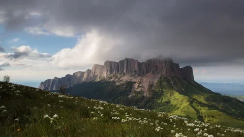 The formation and movement of clouds over the summer slopes of Mountains Stock Footage 149353195