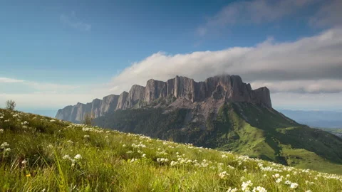 The formation and movement of clouds over the summer slopes of Mountains Stock Footage 149353231
