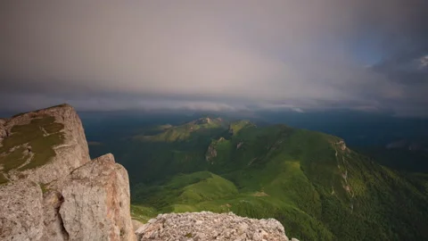 The formation and movement of clouds over the summer slopes of Mountains Stock Footage 149353417