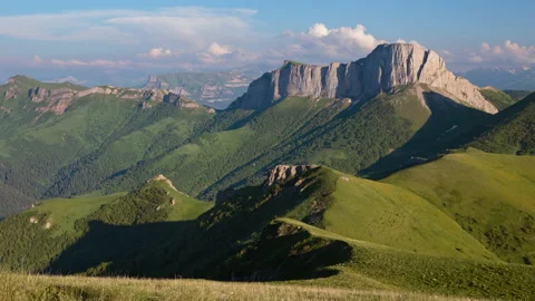 The formation and movement of clouds over the summer slopes of Mountains Stock Footage 149353464