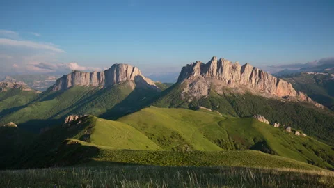 The formation and movement of clouds over the summer slopes of Mountains Stock Footage 149353518