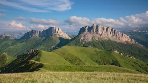 The formation and movement of clouds over the summer slopes of Mountains Stock Footage 149353522