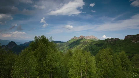 The formation and movement of clouds over the summer slopes of Mountains Stock Footage 149353566