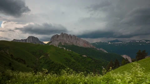 The formation and movement of clouds over the summer slopes of Mountains Stock Footage 149353599