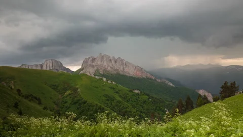 The formation and movement of clouds over the summer slopes of Mountains Stock Footage 149353620