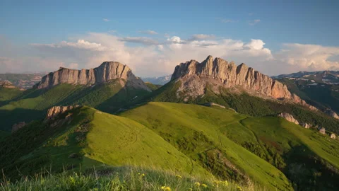 The formation and movement of clouds over the summer slopes of Mountains Stock Footage 149353739
