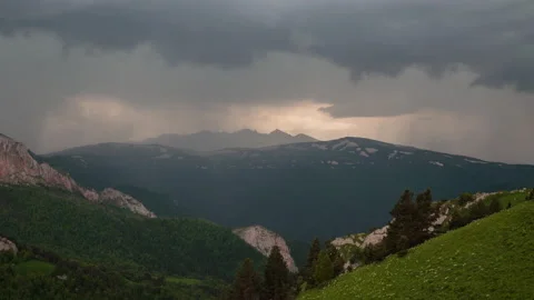 The formation and movement of clouds over the summer slopes of Mountains Stock Footage 149353857
