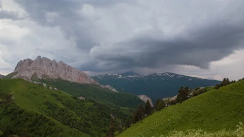 The formation and movement of clouds over the summer slopes of Mountains Stock Footage 149353887