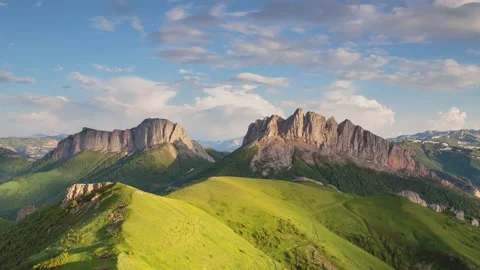 The formation and movement of clouds over the summer slopes of Mountains Stock Footage 149353951