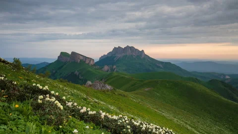 The formation and movement of clouds over the summer slopes of Mountains Stock Footage 149353996