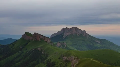 The formation and movement of clouds over the summer slopes of Mountains Stock Footage 149431993