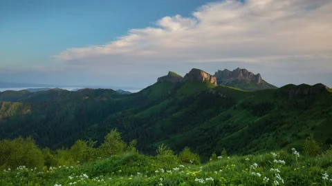The formation and movement of clouds over the summer slopes of Mountains Stock Footage 149432043