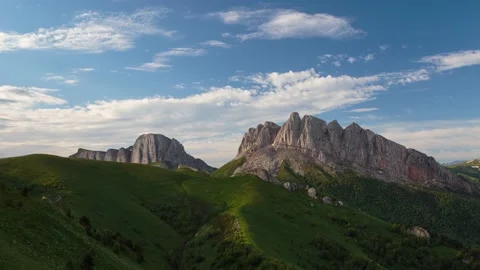 The formation and movement of clouds over the summer slopes of Mountains Stock Footage 149432063
