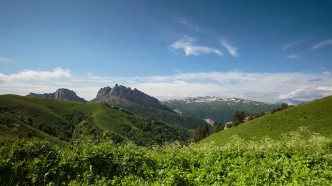 The formation and movement of clouds over the summer slopes of Mountains Stock Footage 149432125
