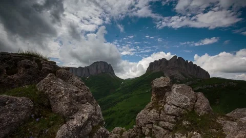 The formation and movement of clouds over the summer slopes of Mountains Stock Footage 149432149