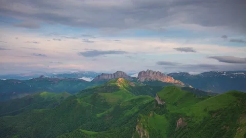 The formation and movement of clouds over the summer slopes of Mountains Stock Footage 149980683