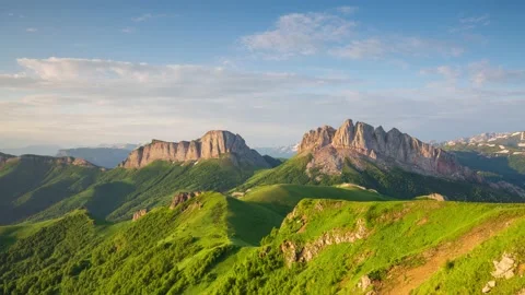 The formation and movement of clouds over the summer slopes of Mountains Stock Footage 149980702