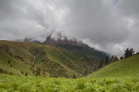 The formation and movement of clouds over the summer slopes of Adygea Bolshoy Stock Photos