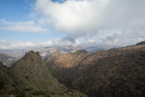 The formation and movement of spring clouds over the high mountains of the .. Stock Photos