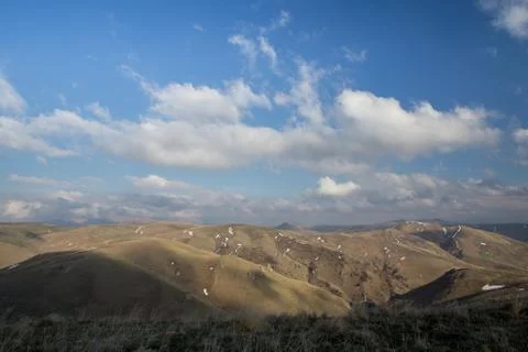 The formation and movement of spring clouds over the high mountains of the .. Stock Photos
