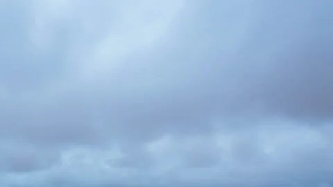 Formation and movement of white clouds of different shapes in the blue sky Stock Footage 94897355