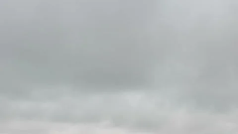 Formation and movement of white clouds of different shapes in the blue sky Stock Footage 94897379