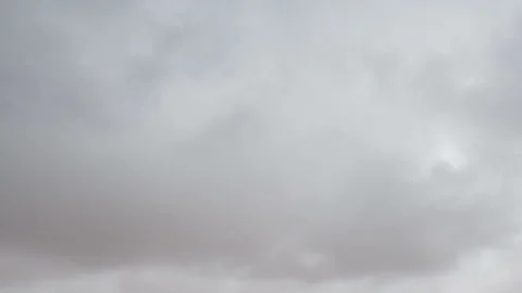 Formation and movement of white clouds of different shapes in the blue sky Stock Footage 94897383