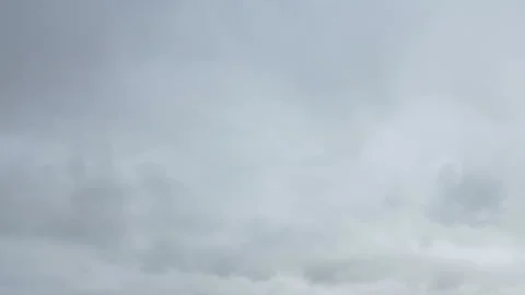 Formation and movement of white clouds of different shapes in the blue sky Stock Footage 94897389