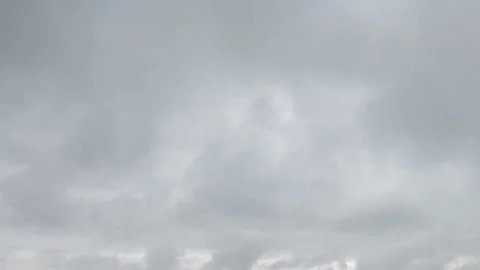 Formation and movement of white clouds of different shapes in the blue sky Stock Footage 94897396