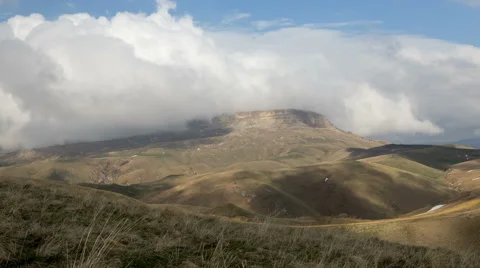 The formation and movements of clouds of the  mountains of Caucasus peaks. Stock-Footage 65212521