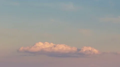 Formation and rapid movement of white clouds of different shapes at sunset Stock Footage 75965928