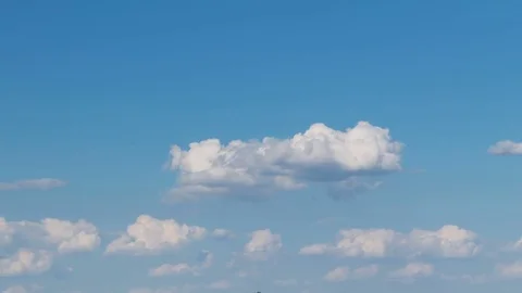 Formation and rapid movement of white clouds of different shapes at sunset Stock Footage 76198086