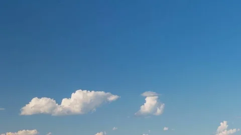 Formation and rapid movement of white clouds of different shapes at sunset Stock Footage 76198108