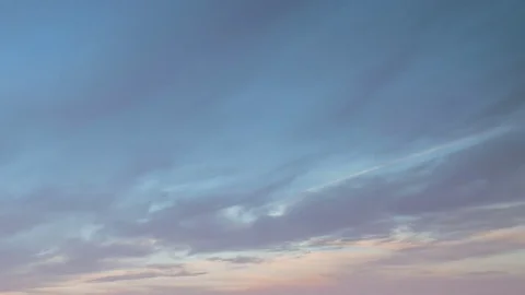 Formation and rapid movement of white clouds of different shapes in the blue sky Stock Footage 77733671