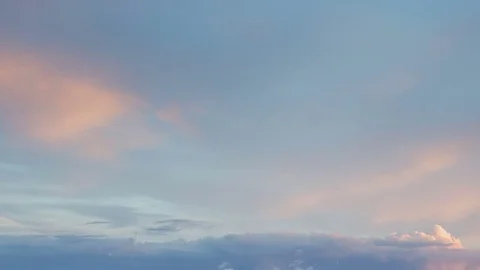 Formation and rapid movement of white clouds of different shapes in the blue sky Stock Footage 77733804