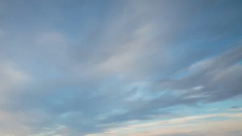Formation and rapid movement of white clouds of different shapes in the blue sky Stock Footage 77734184