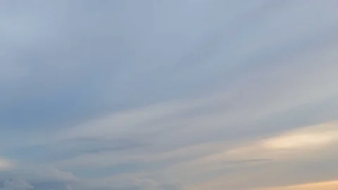 Formation and rapid movement of white clouds of different shapes in the blue sky Stock Footage 77734208