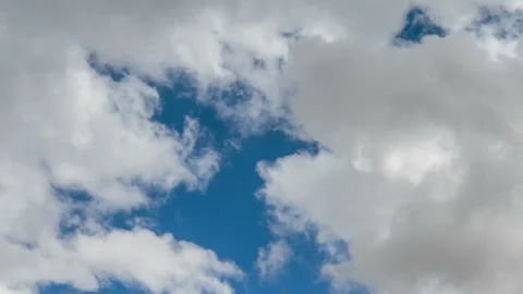 Formation and rapid movement of white clouds in the blue sky in spring Stock Footage 90397967