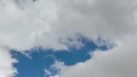 Formation and rapid movement of white clouds in the blue sky in spring Stock Footage 90398043