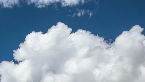 Formation and rapid movement of white clouds in the blue sky in spring Stock Footage 90398064