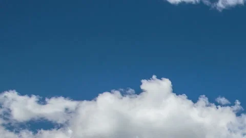 Formation and rapid movement of white clouds in the blue sky in spring Stock Footage 90398087