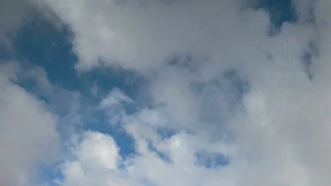 Formation and rapid movement of white clouds in the blue sky in spring Stock Footage 90398096