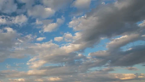 Formation and rapid movement of white clouds in the blue sky in spring Stock Footage 90398368