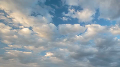 Formation and rapid movement of white clouds in the blue sky in spring Stock Footage 90398393