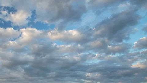 Formation and rapid movement of white clouds in the blue sky in spring Stock Footage 90398458