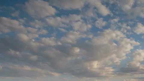 Formation and rapid movement of white clouds in the blue sky in spring Stock Footage 90398493