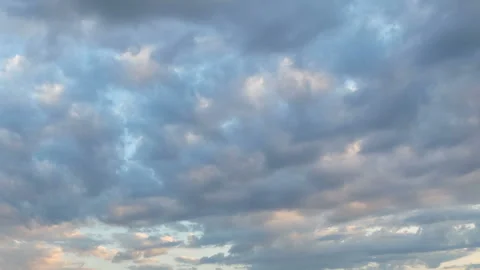Formation and rapid movement of white clouds in the blue sky in spring Stock Footage 90398546